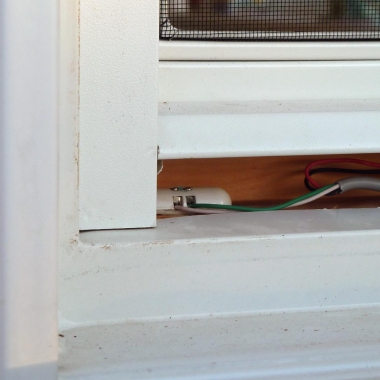 Tane Pill Magnetic Contacts Sensor Installed Underneath Casement Window Trim